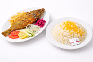 Fried Sheri fish with rice at Najmat Kabab, best Persian restaurant in Dubai