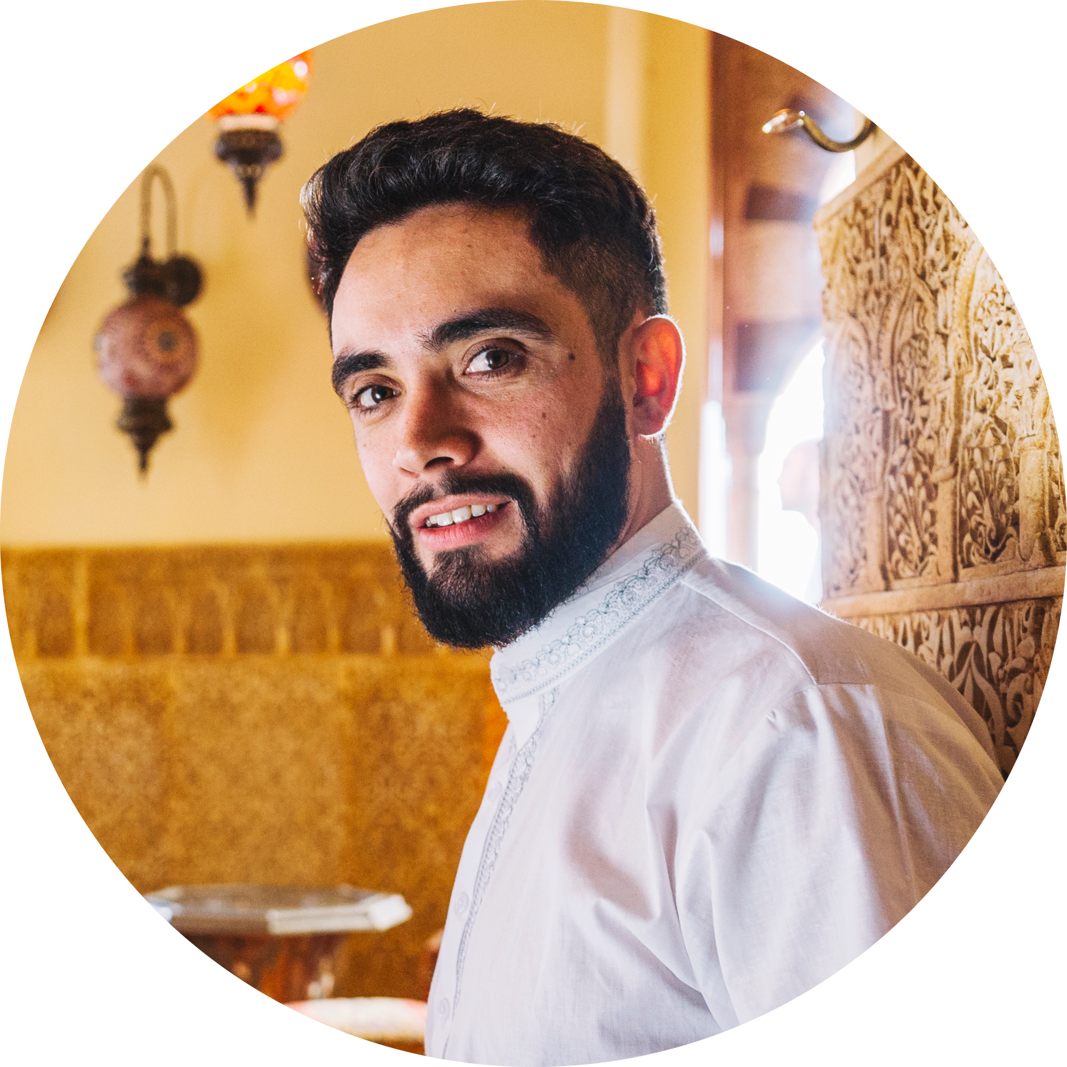 Male customer smiling after enjoying traditional Iranian food at Najmat Kabab, featured in the customer review section.